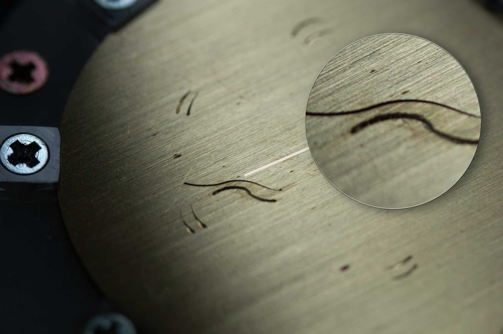 A macro detail of the hand engraving work.