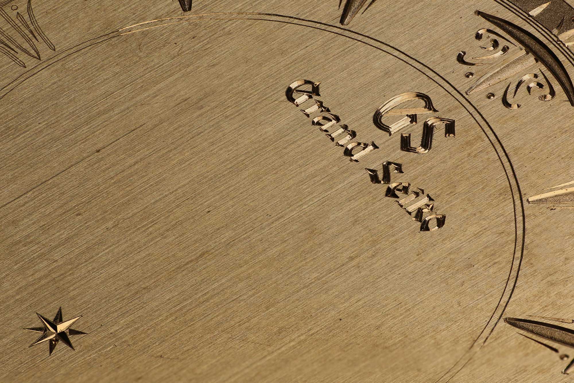 Hand engraving work on a sample dial.