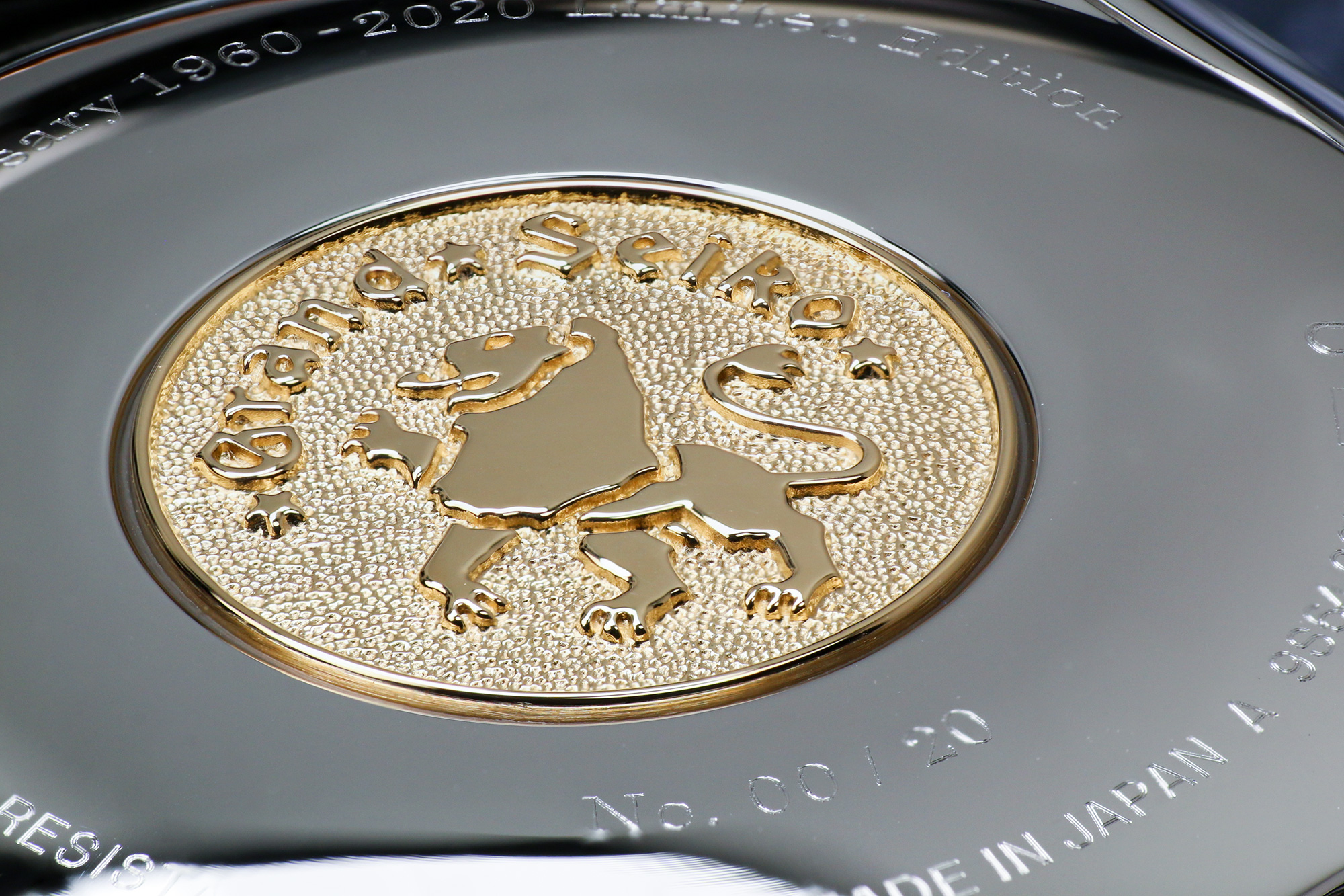 A golden case back medallion on Grand Seiko SBGW263.