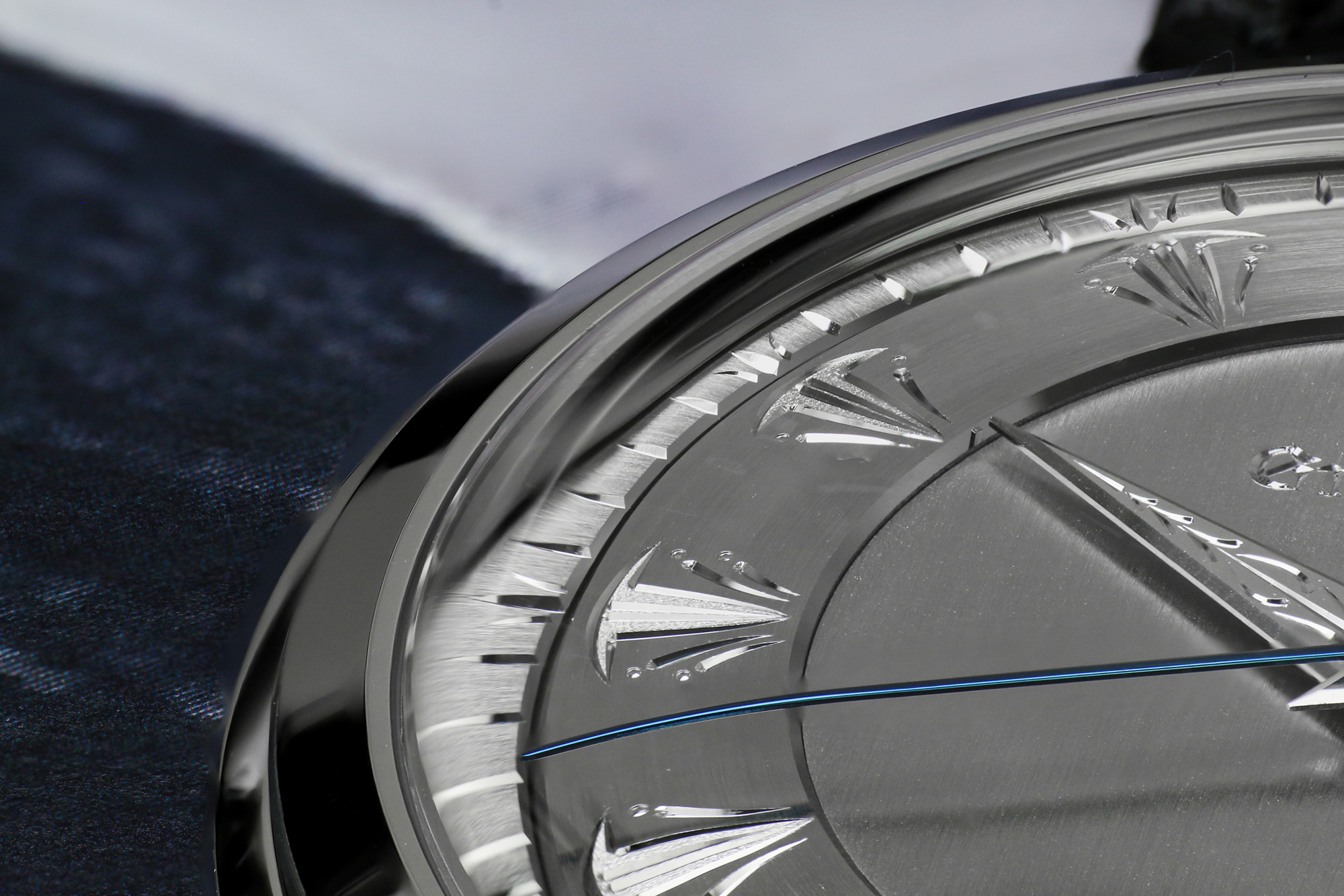 A macro image of the engraving detail of Grand Seiko SBGW263.