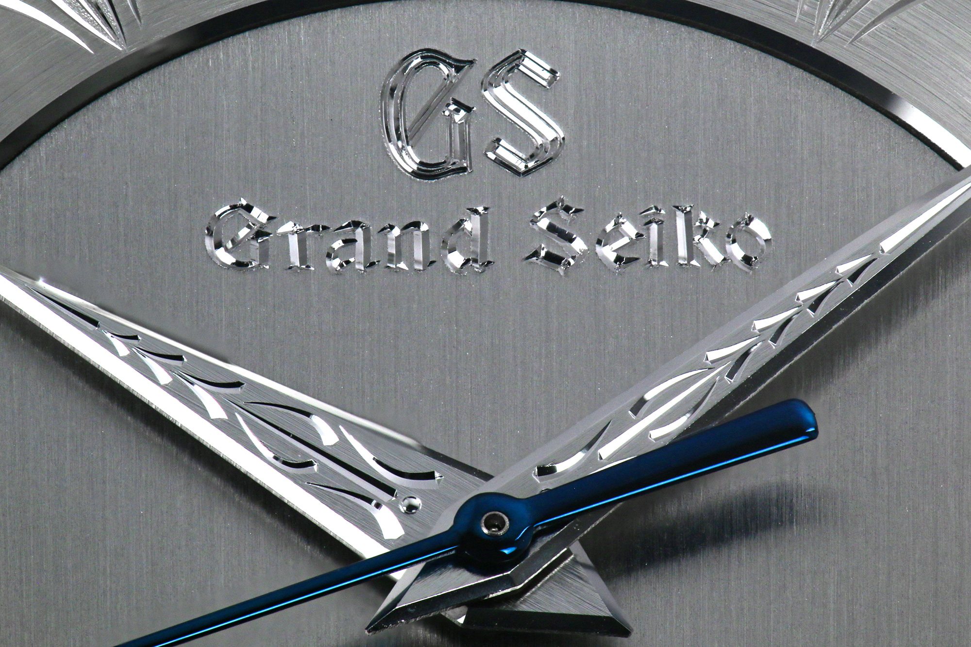 A closeup of the hand engraving work on the dial of Grand Seiko SBGW263.