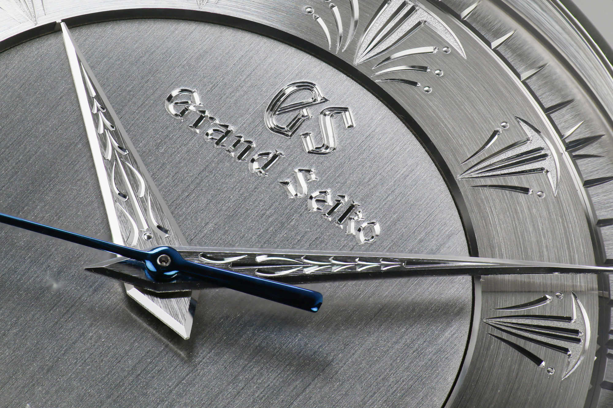 A closeup of the hand engraving work on the dial of Grand Seiko SBGW263.