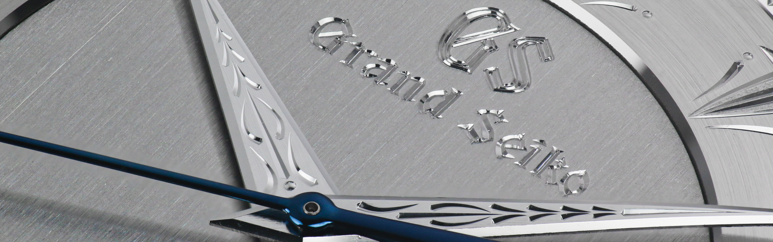 A closeup of the hand engraving work on the dial of Grand Seiko SBGW263.